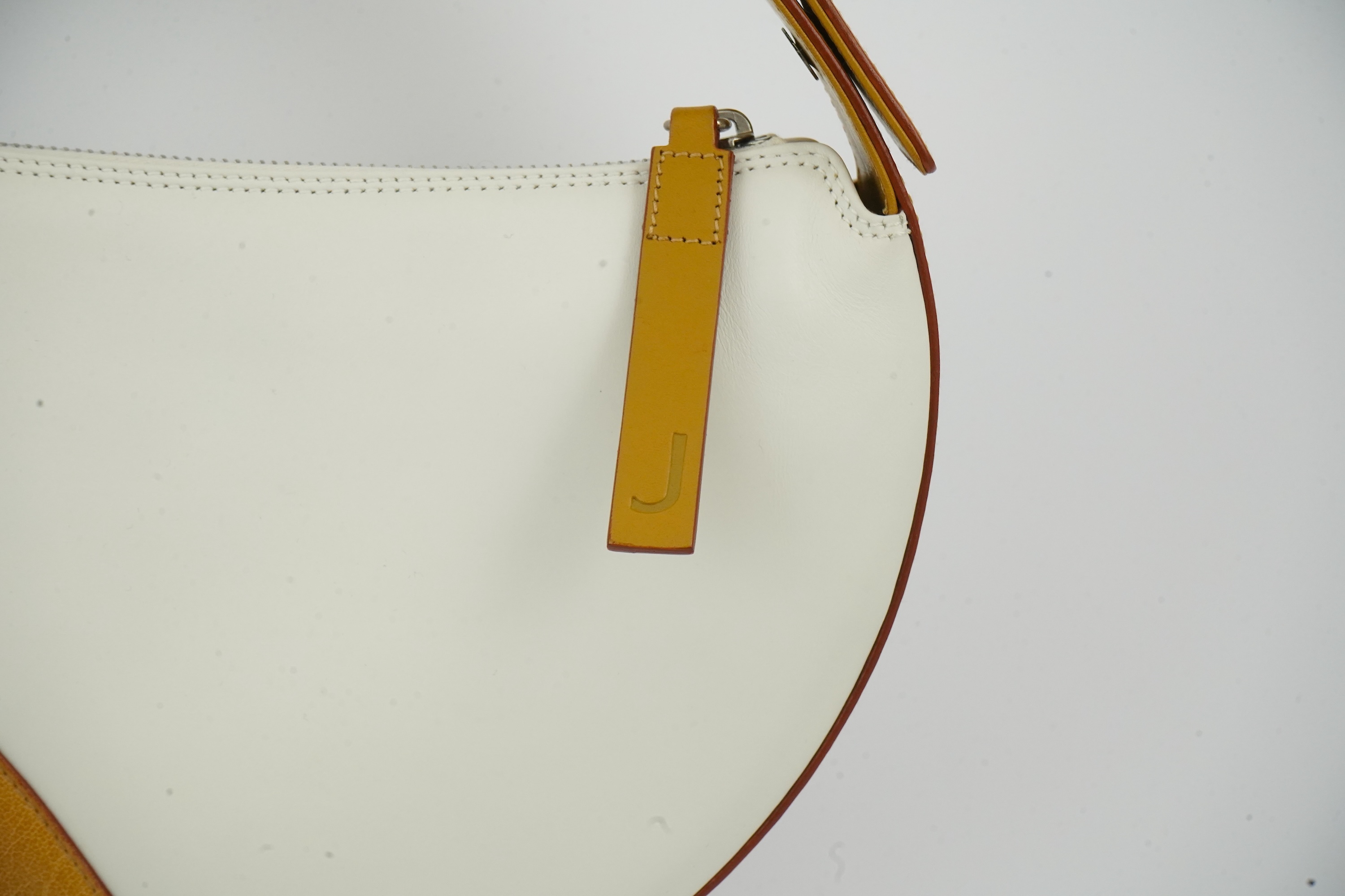 A vintage Jaeger leather white and tan shoulder bag